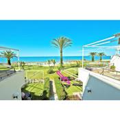 On Beach Deluxe Apartment with Pools and own Garden